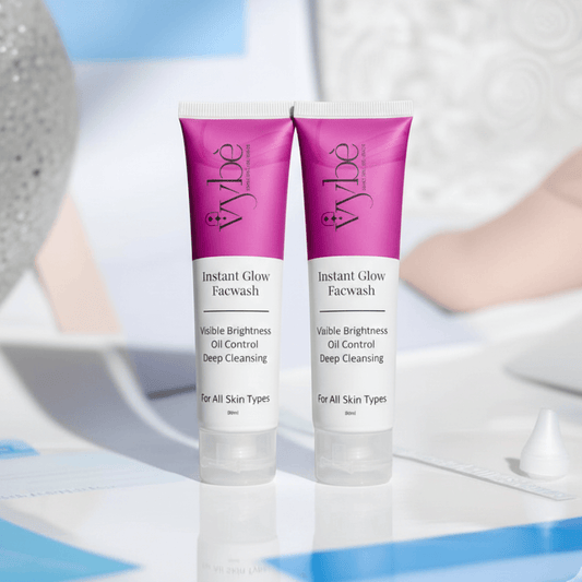 Two bottles of Vybe Instant Glow Face wash on a white background