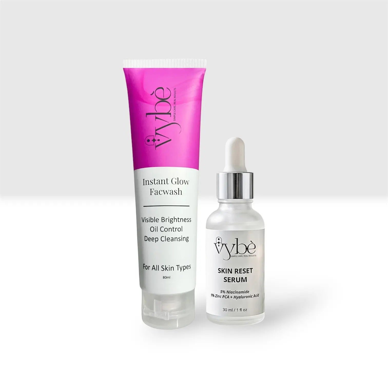 Two skincare products from the brand 'Vybé' on a light gray background